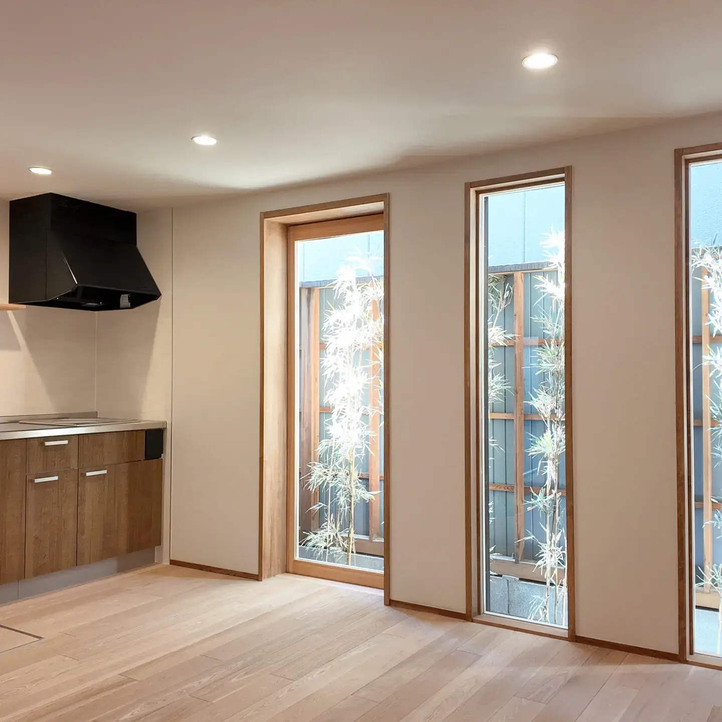 Bright living area with floor-to-ceiling windows in Small Gojo